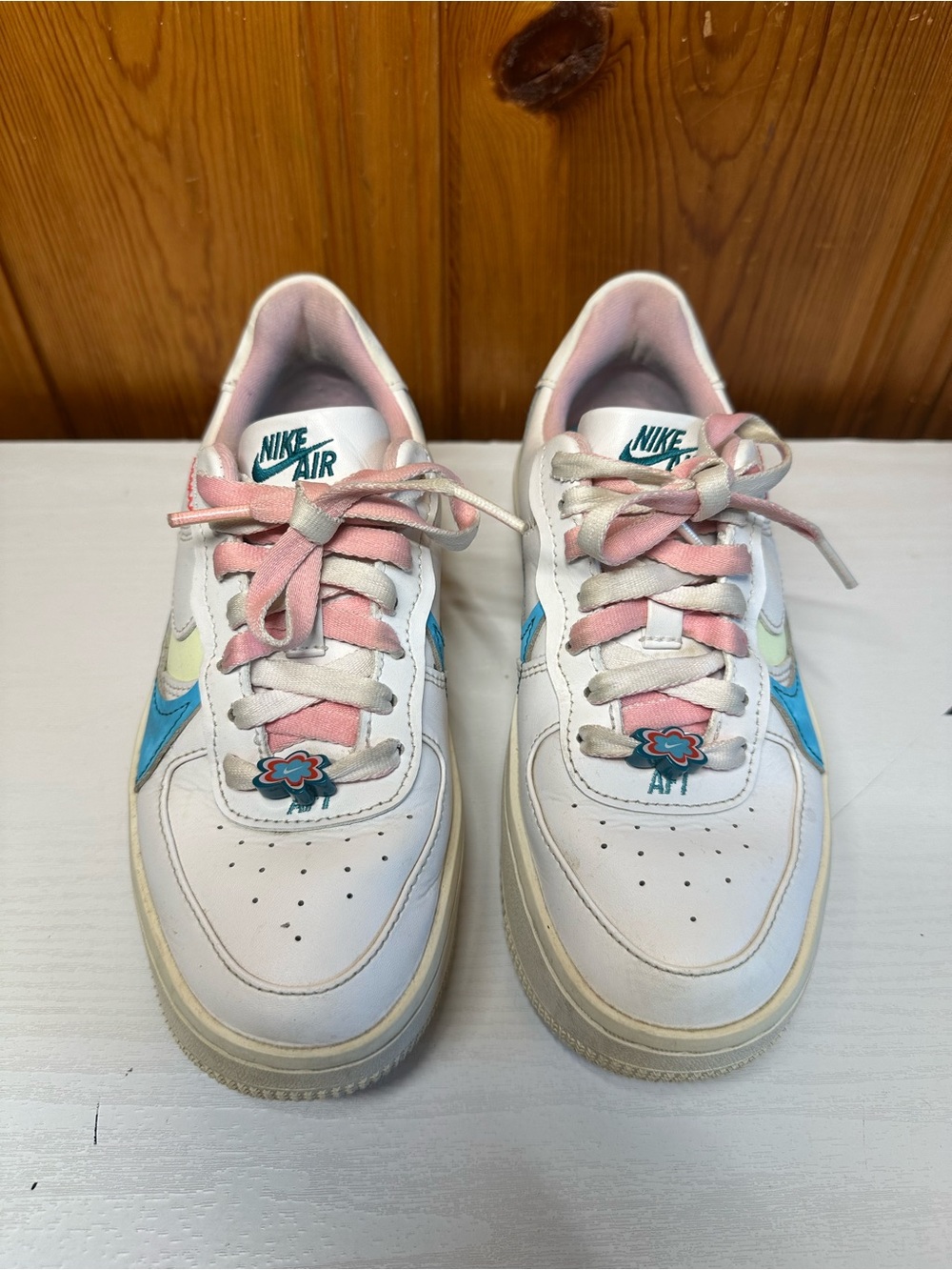 Nike Kids White Sneakers with Pink and Blue Accents